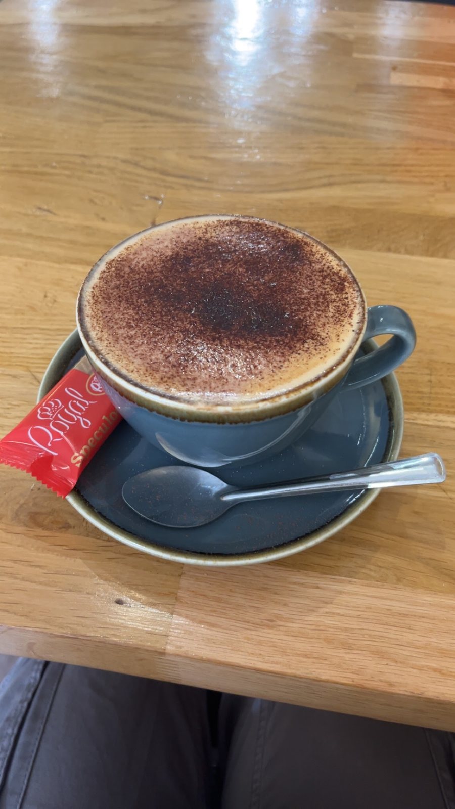 A cappuccino dusted with chocolate.